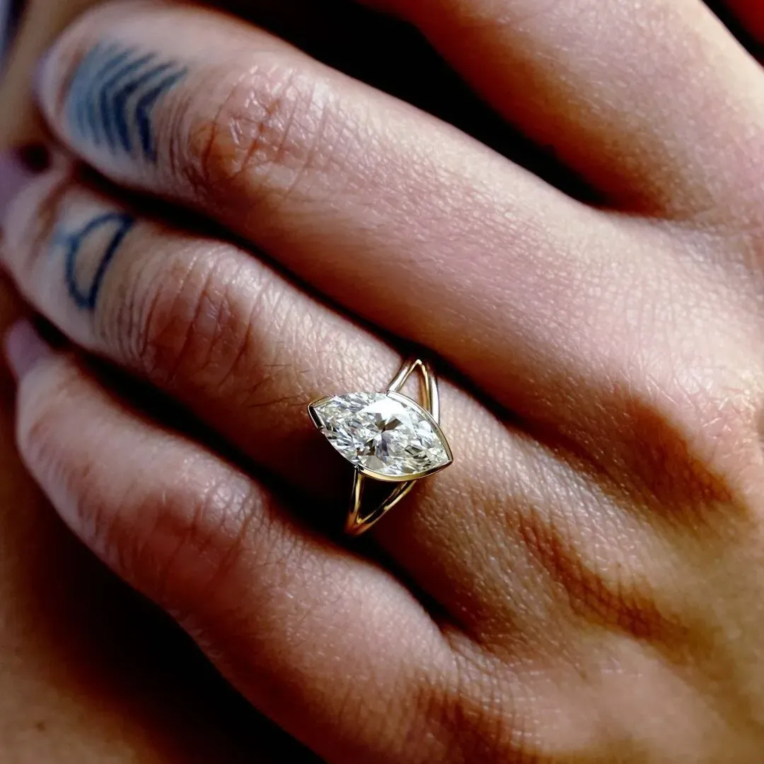 /public/photos/live/Half Bezel Marquise Moissanite Spilt Shank Ring 583 (1).webp